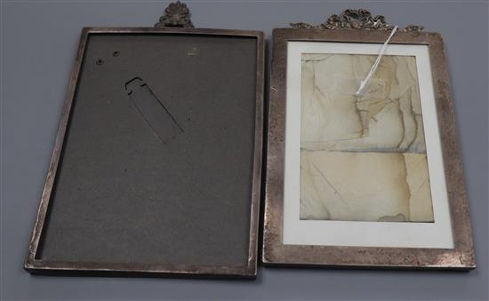 Two early 20th century silver mounted photograph frames, London, 1905 and 1911, both with surmounts, largest 21.5cm.